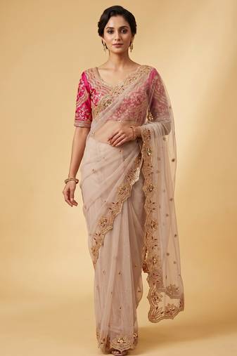 Ivory pink embroidered net designer saree with designer rani pink blouse fabric