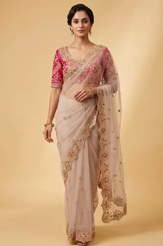 Ivory pink embroidered net designer saree with designer rani pink blouse fabric