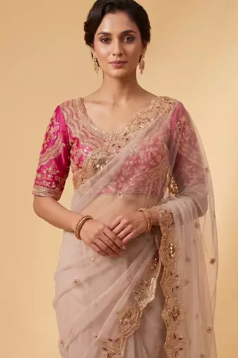 Ivory pink embroidered net designer saree with designer rani pink blouse fabric