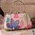   woven reverie coral multi abstract floral embroidered clutch