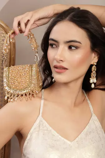   crystal cascade champagne gold suede embellished clutch