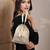   jashn edit champagne faux silk floral jacquard potli