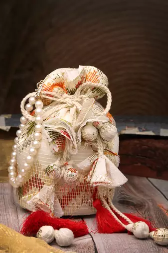   jashn edit ivory faux silk chevron woven potli