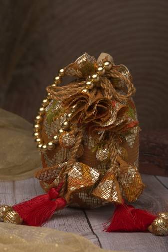   jashn edit rust brown faux silk chevron woven potli