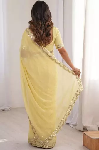 Lemon colour moss chiffon saree with embroidered blouse