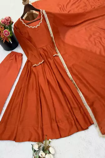 Rust orange solid anarkali kurta with pants and dupatta set
