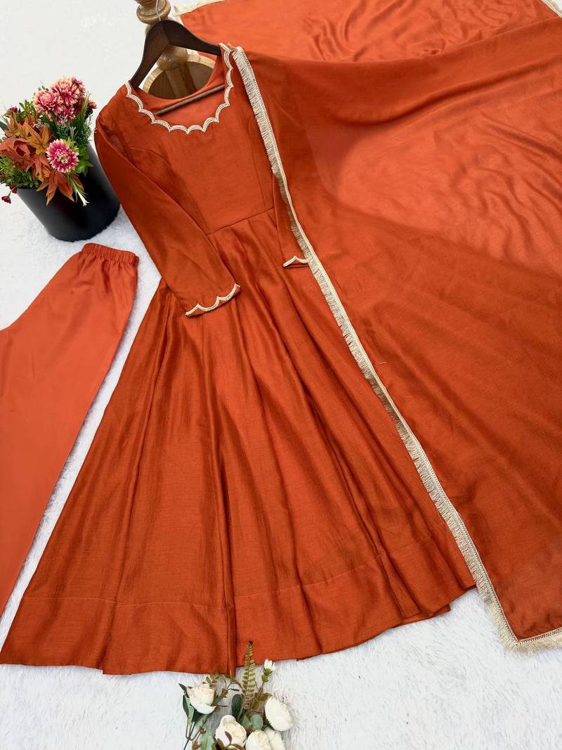 Rust orange solid anarkali kurta with pants and dupatta set