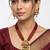 Women gold-plated & green multi-strand lakshmi temple jewellery set