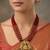 Women gold-plated & ruby multi-strand lakshmi temple jewellery set