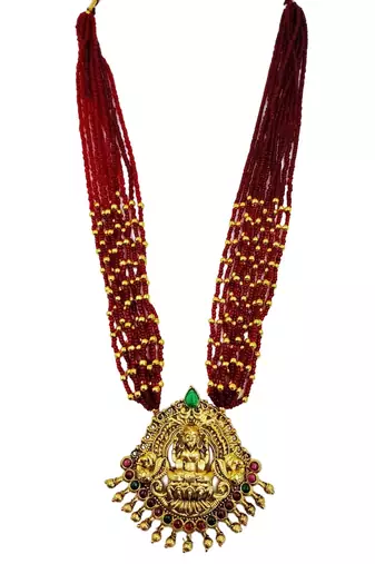 Women gold-plated & ruby multi-strand lakshmi temple jewellery set
