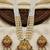 Women gold-plated & white multi-strand lakshmi temple jewellery set