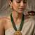 Women gold-plated & green multi-strand lakshmi temple jewellery set