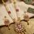Women gold-plated white pearl & red kundan studded traditional long jewellery set
