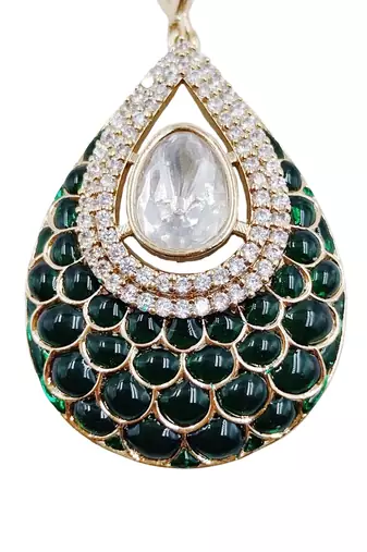 Women green gold-plated ad-studded teardrop pendant with earrings jewellery set
