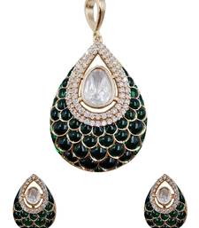 Women green gold-plated ad-studded teardrop pendant with earrings jewellery set