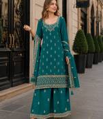 Teal green georgette semi stitched suit with heavy embroidery work