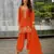 Orange chinon free size stitched suit with embroidery & beats work