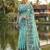Seagreen colour linen saree with floral jacquard weaving & tassel pallu