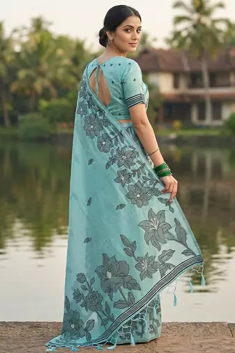 Seagreen colour linen saree with floral jacquard weaving & tassel pallu