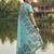 Seagreen colour linen saree with floral jacquard weaving & tassel pallu