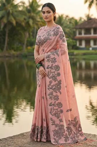 Peach colour linen saree with floral jacquard weaving & tassel pallu