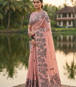 Peach colour linen saree with floral jacquard weaving & tassel pallu