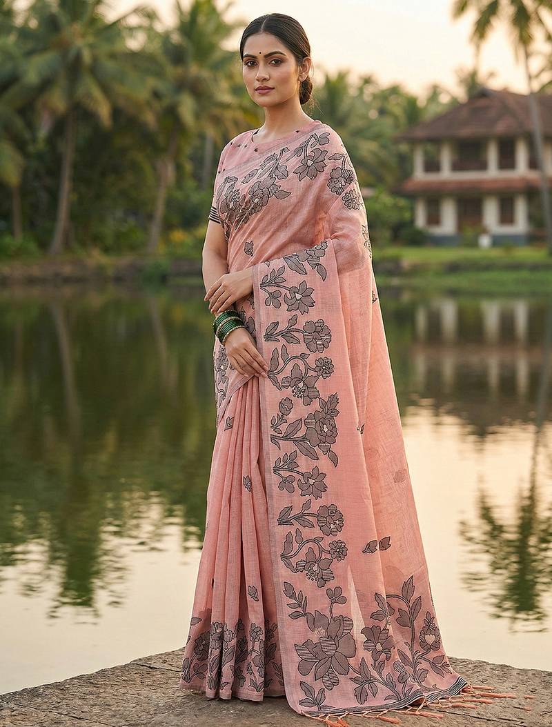Peach colour linen saree with floral jacquard weaving & tassel pallu