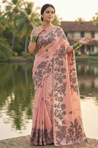 Peach colour linen saree with floral jacquard weaving & tassel pallu
