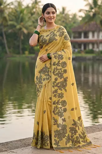Yellow colour linen saree with floral jacquard weaving & tassel pallu