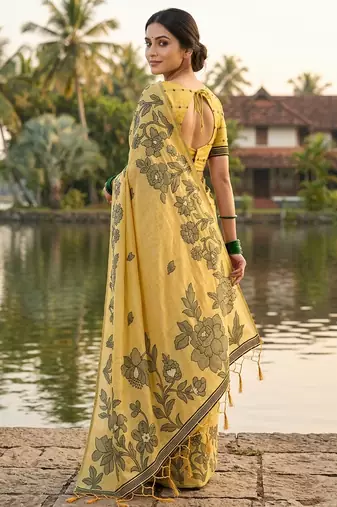 Yellow colour linen saree with floral jacquard weaving & tassel pallu