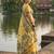 Yellow colour linen saree with floral jacquard weaving & tassel pallu