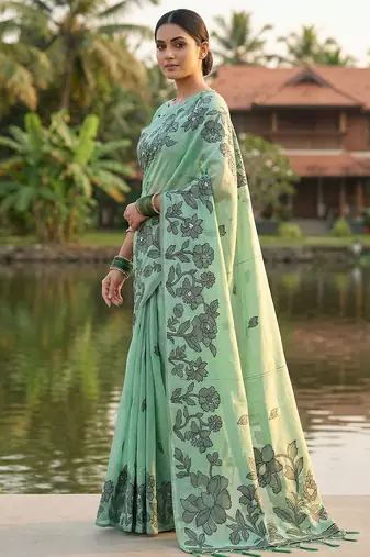 Green colour linen saree with floral jacquard weaving & tassel pallu