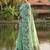 Green colour linen saree with floral jacquard weaving & tassel pallu