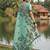 Green colour linen saree with floral jacquard weaving & tassel pallu