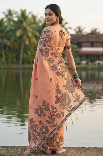 Orange coour linen saree with floral jacquard weaving & tassel pallu