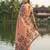 Orange coour linen saree with floral jacquard weaving & tassel pallu