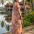 Orange coour linen saree with floral jacquard weaving & tassel pallu