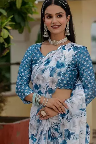Sky blue colour ready to wear floral chinon saree with mirror border