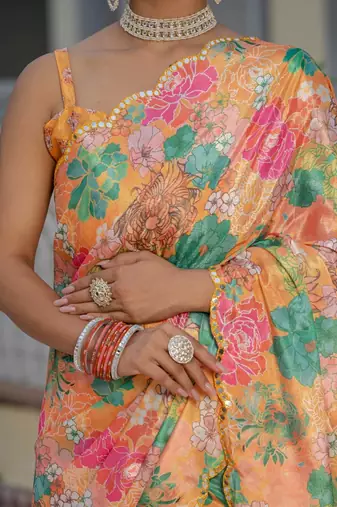 Orange colour ready to wear floral chinon saree with mirror border