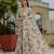 Ivory colour ready to wear floral chinon saree with mirror border