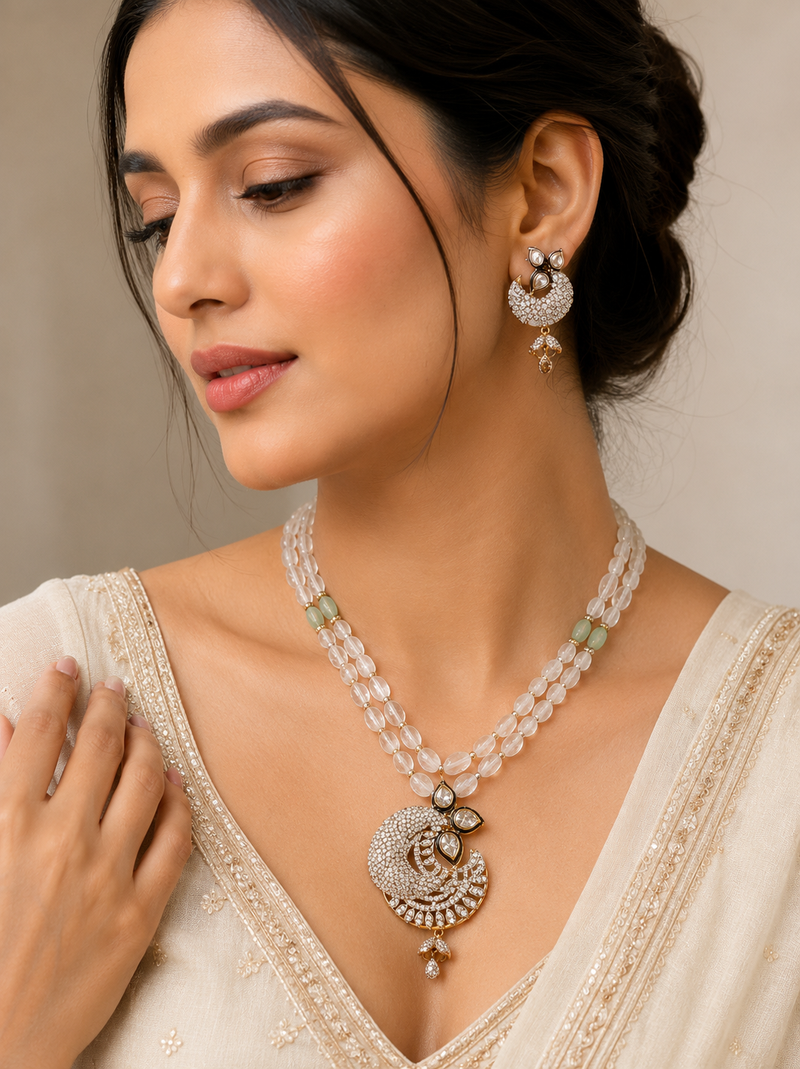 Onyx bead double strand necklace set with kundan peacock pendant and earrings, gold-toned