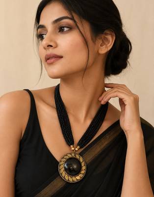 Black multi-strand beaded necklace with round gold leaf pendant, ethnic statement jewellery 1