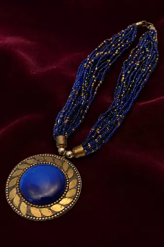 Blue & gold multi-strand beaded necklace with round medallion pendant, boho tribal style