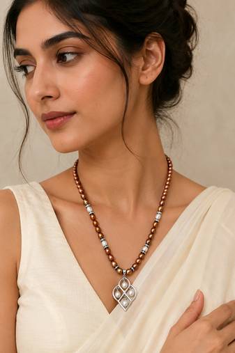 Brown and white pearl beaded necklace with silver geometric pendant, rhinestone accents, magnetic clasp
