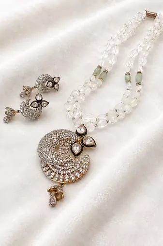 Onyx bead double strand necklace set with kundan peacock pendant and earrings, gold-toned