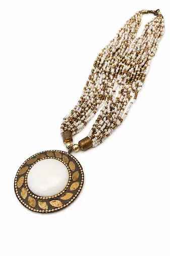 Multi-strand white and gold beaded necklace with round stone pendant, earrings set