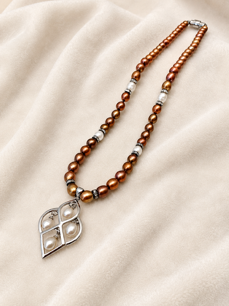 Brown and white pearl beaded necklace with silver geometric pendant, rhinestone accents, magnetic clasp