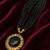 Black multi-strand beaded necklace with round gold leaf pendant, ethnic statement jewellery