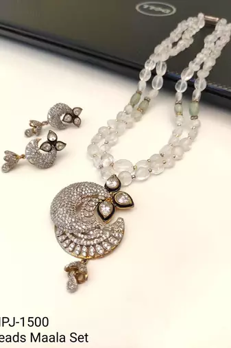 Onyx bead double strand necklace set with kundan peacock pendant and earrings, gold-toned
