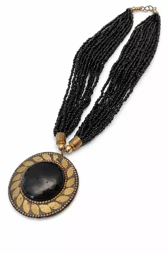 Black multi-strand beaded necklace with round gold leaf pendant, ethnic statement jewellery